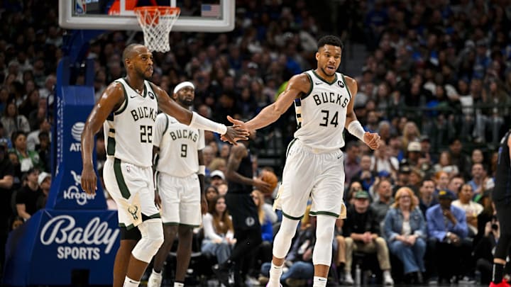 Feb 3, 2024; Dallas, Texas, USA; Milwaukee Bucks forward Khris Middleton (22) and forward Giannis Antetokounmpo (34) celebrate during the second quarter against the Dallas Mavericks at the American Airlines Center. Mandatory Credit: Jerome Miron-Imagn Images