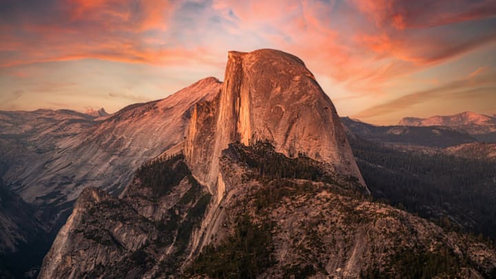From Yosemite National Park’s Glacier Point, hikers can witness Half Dome bathed in alpenglow.