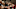 A group of people sitting in the audience of a concert hall and applauding A group of people sitting in the audience of a concert hall and applauding