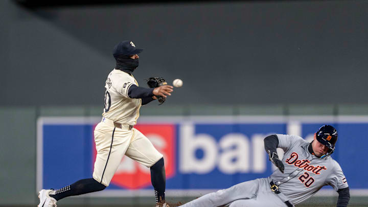 Minnesota Twins shortstop Willi Castro (50) forces out Detroit Tigers first baseman Spencer Torkelson (20) sliding into second base and throws the ball to first base for a double play in the sixth inning at Target Field in Minneapolis on April 19, 2024. 
