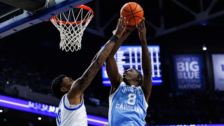 Dec 2, 2025; Lexington, Kentucky, USA; North Carolina Tar Heels forward Caleb Wilson (8) goes to the basket against Kentucky Wildcats forward Brandon Garrison (10) during the first half at Rupp Arena at Central Bank Center.