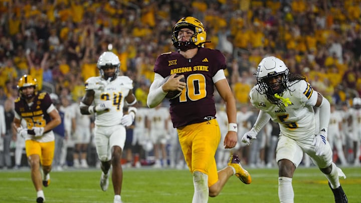 Arizona State quarterback Sam Leavitt (10) scores a touchdown against NAU during a game at Mountain America Stadium in Tempe on Aug. 30, 2025.