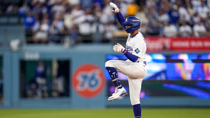 Los Angeles Dodgers shortstop Mookie Betts (50) celebrates a double in the first inning of the MLB National League Wild Card Game 2 between the Los Angeles Dodgers and the Cincinnati Reds at Dodger Stadium in Los Angeles on Wednesday, Oct. 1, 2025. The Reds were eliminated from the postseason with an 8-4 loss to the reining World Series Champions La Dodgers.