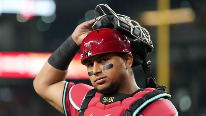 Apr 29, 2024; Phoenix, Arizona, USA; Arizona Diamondbacks catcher Gabriel Moreno (14) looks on against the Los Angeles Dodgers during the fourth inning at Chase Field. Mandatory Credit: Joe Camporeale-USA TODAY Sports Apr 29, 2024; Phoenix, Arizona, USA; Arizona Diamondbacks catcher Gabriel Moreno (14) looks on against the Los Angeles Dodgers during the fourth inning at Chase Field. Mandatory Credit: Joe Camporeale-USA TODAY Sports