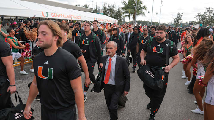 Oct 17, 2025; Miami Gardens, Florida, USA; Miami Hurricanes offensive line coach Alex Mirabal during the Hurricanes Walk before the game against the Louisville Cardinals at Hard Rock Stadium. Mandatory Credit: Sam Navarro-Imagn Images