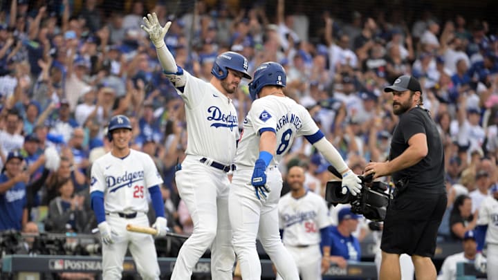 Oct 11, 2024; Los Angeles, California, USA; Los Angeles Dodgers third baseman Enrique Hernandez (8) celebrates with second baseman Gavin Lux (9) zafter hitting a solo home run in the second inning against the San Diego Padres during game five of the NLDS for the 2024 MLB Playoffs at Dodger Stadium. Mandatory Credit: Jayne Kamin-Oncea-Imagn Images