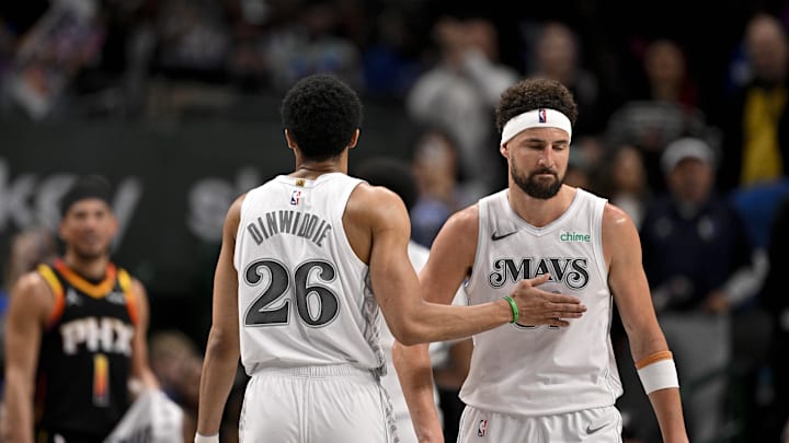 Mar 9, 2025; Dallas, Texas, USA; Dallas Mavericks guard Spencer Dinwiddie (26) and guard Klay Thompson (31) walk off the court after the loss to the Phoenix Suns at the American Airlines Center. Mandatory Credit: Jerome Miron-Imagn Images
