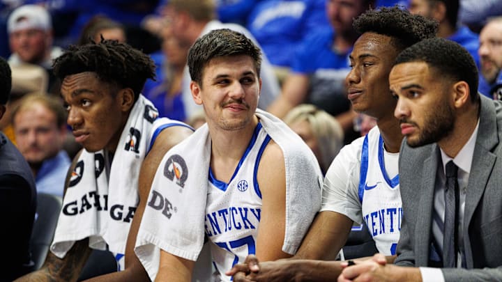 Nov 22, 2024; Lexington, Kentucky, USA; Kentucky Wildcats guard Kerr Kriisa (77) smirks at guard Jaxson Robinson (2) on the bench during the second half against the Jackson State Tigers at Rupp Arena at Central Bank Center. Mandatory Credit: Jordan Prather-Imagn Images