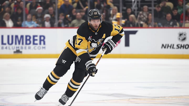 Dec 21, 2025; Pittsburgh, Pennsylvania, USA;  Pittsburgh Penguins right wing Bryan Rust (17) skates up ice with the puck against the Montréal Canadiens during the first period at PPG Paints Arena. Mandatory Credit: Charles LeClaire-Imagn Images