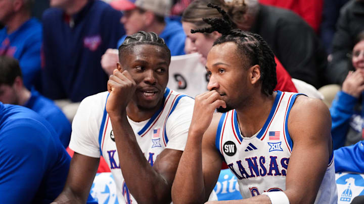 Jan 16, 2026; Lawrence, Kansas, USA; Kansas Jayhawks forward Flory Bidunga (40) and guard Darryn Peterson (22) talk on the bench against the Baylor Bears during the second half of the game at Allen Fieldhouse. Mandatory Credit: Denny Medley-Imagn Images