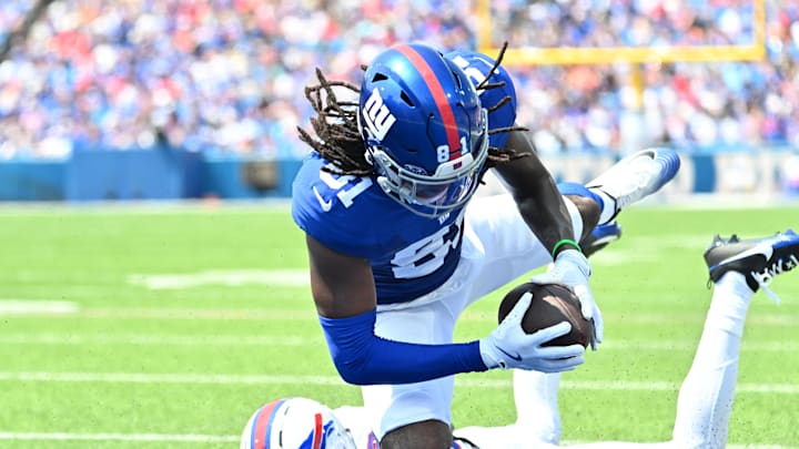 Aug 9, 2025; Orchard Park, New York, USA; New York Giants wide receiver Lil'Jordan Humphrey (81) catches a pass for a touchdown as Buffalo Bills cornerback Dane Jackson (23) defends in the second quarter at Highmark Stadium.  