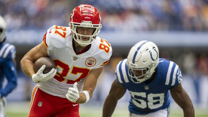 Sep 25, 2022; Indianapolis, Indiana, USA; Kansas City Chiefs tight end Travis Kelce (87) runs toward the end zone away from Indianapolis Colts linebacker Bobby Okereke (58) during the first quarter at Lucas Oil Stadium. Mandatory Credit: Marc Lebryk-Imagn Images