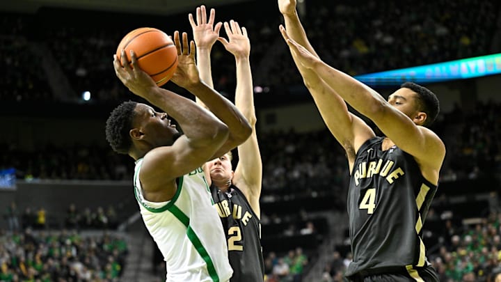 Oregon Ducks guard TJ Bamba drives to the basket against Purdue Boilermakers forward Trey Kaufman-Renn Oregon Ducks guard TJ Bamba drives to the basket against Purdue Boilermakers forward Trey Kaufman-Renn
