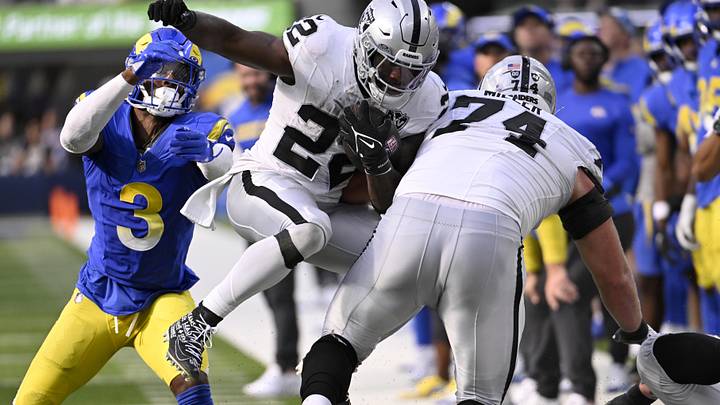 Oct 20, 2024; Inglewood, California, USA; Los Angeles Rams safety Kamren Curl (3) pushes Las Vegas Raiders running back Alexander Mattison (22) into offensive tackle Kolton Miller (74) to stop a run in the second half at SoFi Stadium. Mandatory Credit: Alex Gallardo-Imagn Images