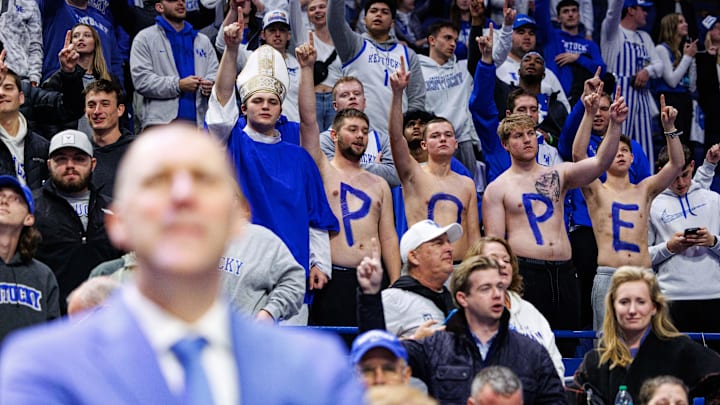 Dec 14, 2024; Lexington, Kentucky, USA; Kentucky Wildcats fans stand with the letters POPE painted on their stomachs after the game against the Louisville Cardinals at Rupp Arena at Central Bank Center. Mandatory Credit: Jordan Prather-Imagn Images