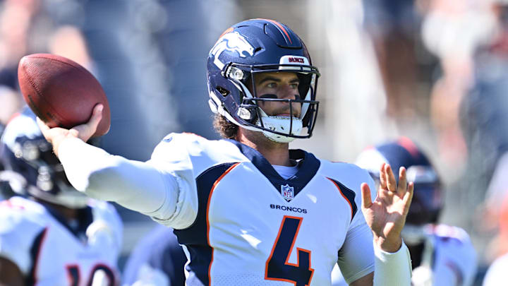 Oct 1, 2023; Chicago, Illinois, USA;  Denver Broncos quarterback Jarrett Stidham (4) warms up before