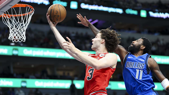  Chicago Bulls guard Josh Giddey (3) shoots past Dallas Mavericks guard Kyrie Irving (11) during the first quarter at American Airlines Center. Mandatory Credit: Kevin Jairaj-Imagn Images
