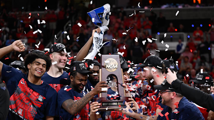 Mar 28, 2026; San Jose, CA, USA; The Arizona Wildcats celebrates with the West Regional Championship trophy after an Elite Eight game against the Purdue Boilermakers of the West Regional of the men's 2026 NCAA Tournament at SAP Center. Mandatory Credit: Eakin Howard-Imagn Images