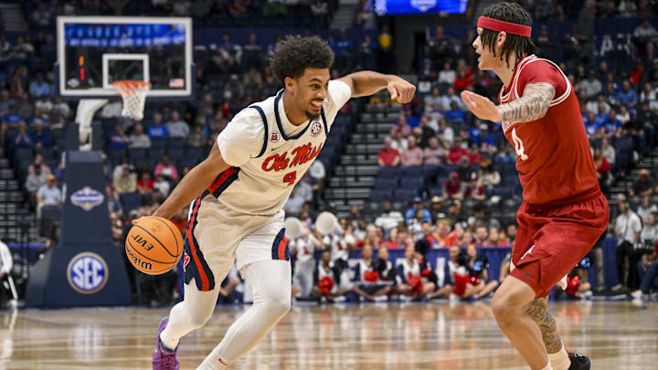 Mar 13, 2025; Nashville, TN, USA; Mississippi Rebels forward Jaemyn Brakefield (4) drives to the basket as Arkansas Razorbacks forward Trevon Brazile (4) defends during the first half at Bridgestone Arena. Mandatory Credit: Steve Roberts-Imagn Images Mar 13, 2025; Nashville, TN, USA; Mississippi Rebels forward Jaemyn Brakefield (4) drives to the basket as Arkansas Razorbacks forward Trevon Brazile (4) defends during the first half at Bridgestone Arena. Mandatory Credit: Steve Roberts-Imagn Images