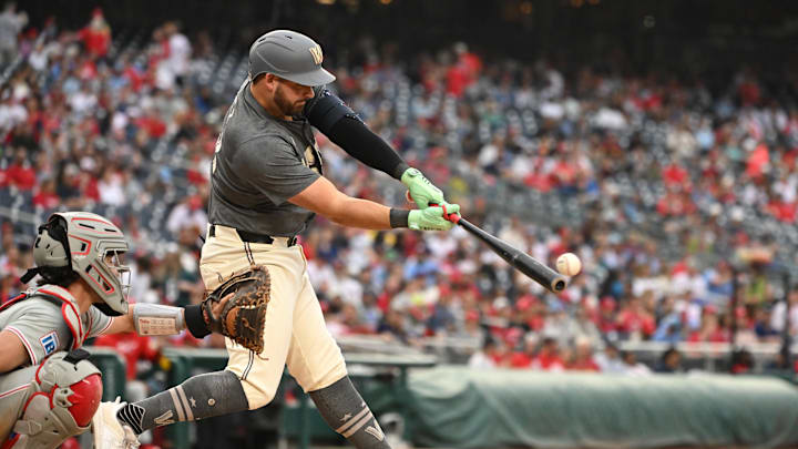 Sep 29, 2024; Washington, District of Columbia, USA; Washington Nationals first baseman Juan Yepez (18) hits the ball into play against the Philadelphia Phillies during the fifth inning at Nationals Park. Mandatory Credit: Rafael Suanes-Imagn Images