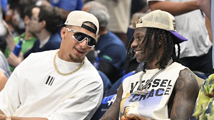 May 26, 2024; Dallas, Texas, USA; Kansas City Chiefs players Patrick Mahomes (left) and Hollywood Brown (right) look on in the first half between the Dallas Mavericks and the Minnesota Timberwolves during game three of the western conference finals for the 2024 NBA playoffs at American Airlines Center. Mandatory Credit: Jerome Miron-Imagn Images