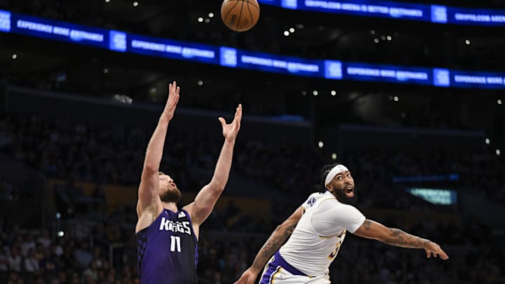 Oct 26, 2024; Los Angeles, California, USA; Sacramento Kings forward Domantas Sabonis (11) attempts get the rebound against Los Angeles Lakers forward Anthony Davis (3) during the first half at Crypto.com Arena. Mandatory Credit: Jonathan Hui-Imagn Images