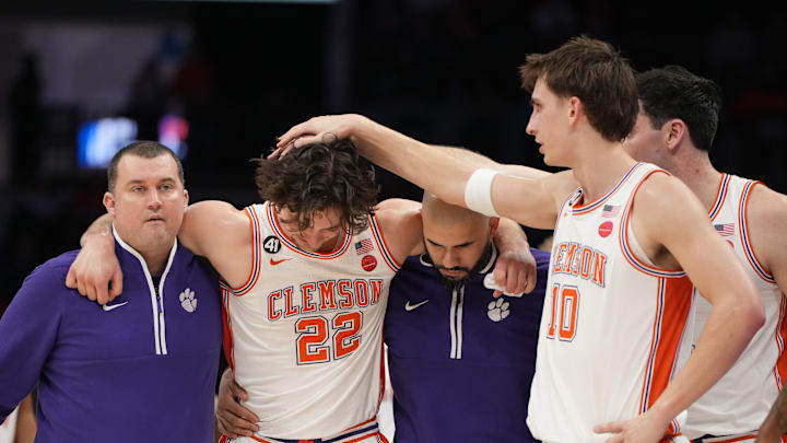 Mar 11, 2026; Charlotte, NC, USA; Clemson Tigers forward Jake Wahlin (10) rubs center Carter Welling (22) as he is taken to the locker room in the first half at Spectrum Center. Mandatory Credit: Bob Donnan-Imagn Images