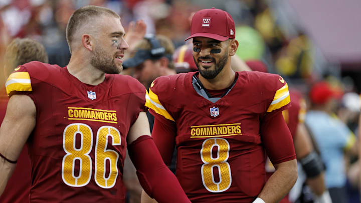 Washington Commanders quarterback Marcus Mariota and Washington Commanders tight end Zach Ertz.