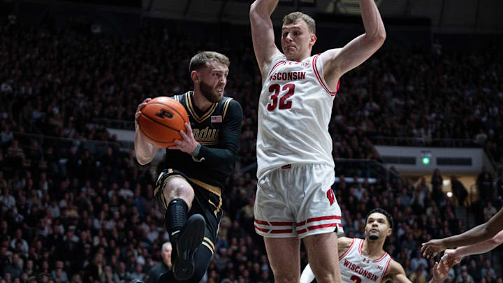 Mar 7, 2026; West Lafayette, Indiana, USA; Purdue Boilermakers guard Braden Smith (3) looks for an open teammate while Wisconsin Badgers forward Aleksas Bieliauskas (32) guards during the second half at Mackey Arena. 