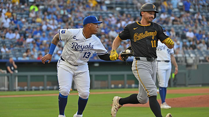 Jul 9, 2025; Kansas City, Missouri, USA;  Kansas City Royals first baseman Salvador Perez (13) tags out Pittsburgh Pirates right fielder Bryan Reynolds (10) running up the first base line in the first inning at Kauffman Stadium. Mandatory Credit: Peter Aiken-Imagn Images