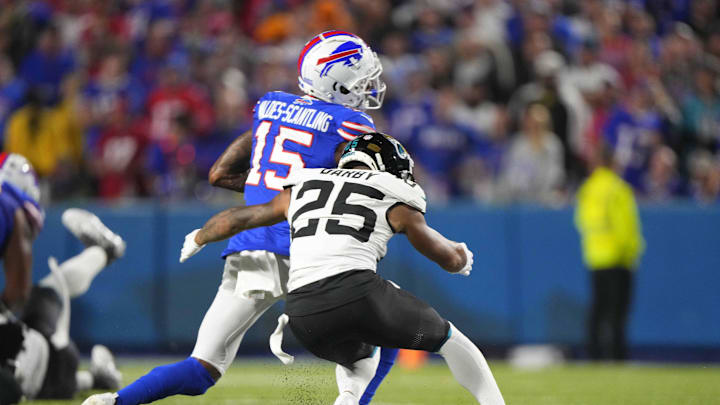 Sep 23, 2024; Orchard Park, New York, USA; Jacksonville Jaguars cornerback Ronald Darby (25) tackles Buffalo Bills wide receiver Marquez Valdes0Scantling (15) during the first half at Highmark Stadium. Mandatory Credit: Gregory Fisher-Imagn Images