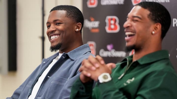 Cincinnati Bengals receivers Tee Higgins (left) and Ja’marr Chase take the stage during a press conference to announce the signing of new contracts for the pair at Paycor Stadium in downtown Cincinnati on Tuesday, March 18, 2025. Chase becomes the new highest-paid non-quarterback player in the NFL. Cincinnati Bengals receivers Tee Higgins (left) and Ja’marr Chase take the stage during a press conference to announce the signing of new contracts for the pair at Paycor Stadium in downtown Cincinnati on Tuesday, March 18, 2025. Chase becomes the new highest-paid non-quarterback player in the NFL.