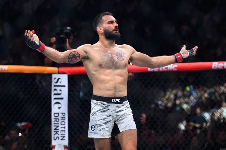 Benoit Saint Denis (red gloves) reacts after the fight against Mauricio Ruffy (blue gloves) during UFC Fight Night at Accor A
