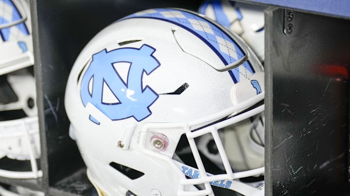 Dec 27, 2023; Charlotte, NC, USA; North Carolina Tar Heels white helmet during pregame warm ups against the West Virginia Mountaineers at Bank of America Stadium. 