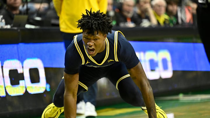Jan 17, 2026; Eugene, Oregon, USA; Michigan Wolverines guard L.J. Cason (2) reacts to a loose ball play during the second half] against the Oregon Ducks at Matthew Knight Arena. Mandatory Credit: Craig Strobeck-Imagn Images