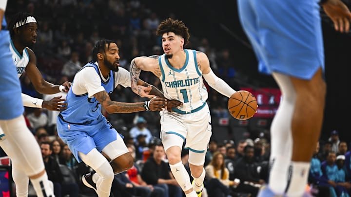Mar 16, 2025; Inglewood, California, USA; Charlotte Hornets guard LaMelo Ball (1) moves the ball against LA Clippers forward Derrick Jones Jr. (55) during the first half at Intuit Dome. Mandatory Credit: Jonathan Hui-Imagn Images Mar 16, 2025; Inglewood, California, USA; Charlotte Hornets guard LaMelo Ball (1) moves the ball against LA Clippers forward Derrick Jones Jr. (55) during the first half at Intuit Dome. Mandatory Credit: Jonathan Hui-Imagn Images