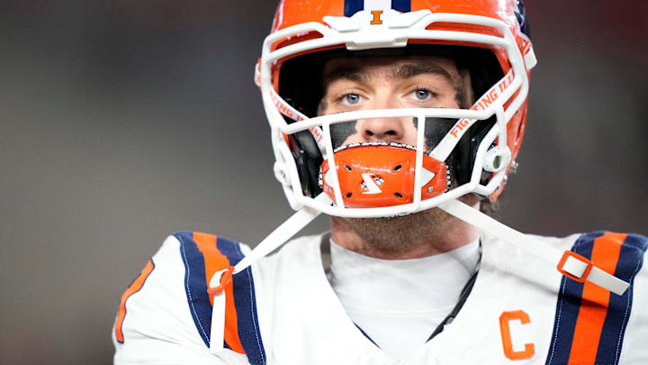 Nov 22, 2025; Madison, Wisconsin, USA; Illinois Fighting Illini quarterback Luke Altmyer (9) warms up before a game against the Wisconsin Badgers at Camp Randall Stadium. Mandatory Credit: Kayla Wolf-Imagn Images