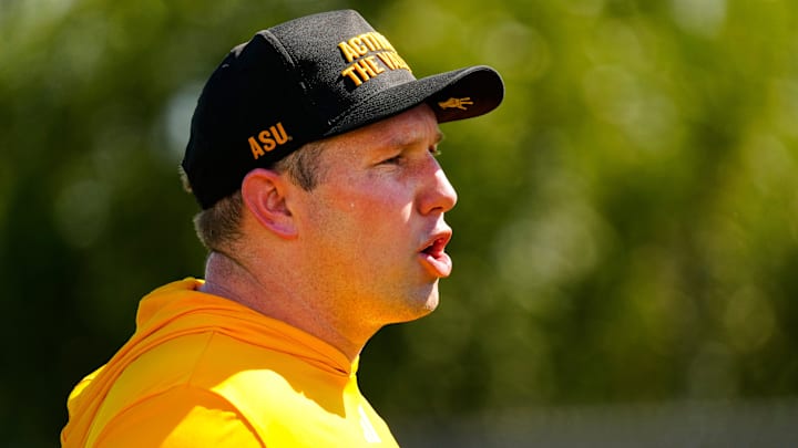 Arizona State head coach Kenny Dillingham yells to his defensive linemen as they run a drill during the first day of fall practice in Tempe, Ariz. on July 30, 2025.