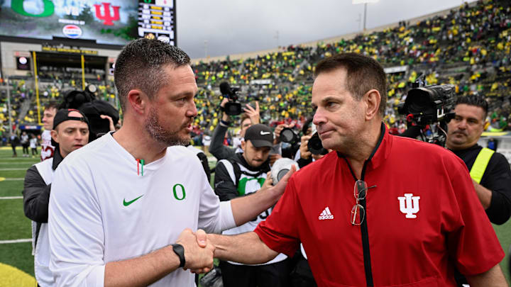 Oct 11, 2025; Eugene, Oregon, USA; Oregon Ducks head coach Dan Lanning shakes hands with Indiana Hoosiers head coach Curt Cignetti after Indiana defeated Oregon by the score of 30-20 at Autzen Stadium. Mandatory Credit: Troy Wayrynen-Imagn Images Oct 11, 2025; Eugene, Oregon, USA; Oregon Ducks head coach Dan Lanning shakes hands with Indiana Hoosiers head coach Curt Cignetti after Indiana defeated Oregon by the score of 30-20 at Autzen Stadium. Mandatory Credit: Troy Wayrynen-Imagn Images