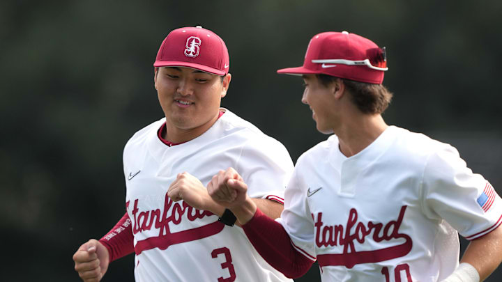 Feb 28, 2025; Stanford, CA, USA; Stanford Cardinal first baseman Rintaro Sasaki (3) bumps fists with center fielder Charlie Bates (10) before the game against the Xavier Musketeers at Sunken Diamond. Mandatory Credit: Darren Yamashita-Imagn Images