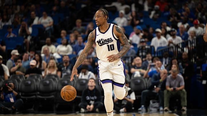 Mar 29, 2025; Orlando, Florida, USA; Sacramento Kings guard/forward DeMar DeRozan (10) dribbles the ball against the Orlando Magic in the first quarter  at Kia Center. Mandatory Credit: Jeremy Reper-Imagn Images
