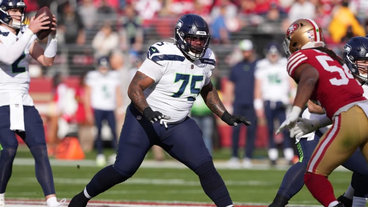 Dec 10, 2023; Santa Clara, California, USA; Seattle Seahawks guard Anthony Bradford (75) blocks against San Francisco 49ers linebacker Fred Warner (right) during the first quarter at Levi's Stadium. Mandatory Credit: Darren Yamashita-USA TODAY Sports