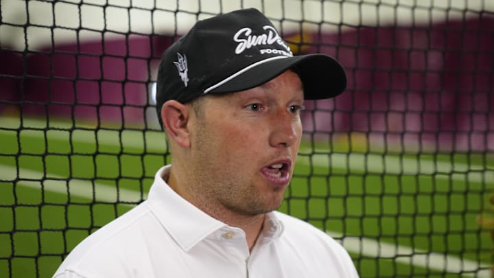 ASU head coach Kenny Dillingham talks with the press during an ASU annual kids football camp inside the Verde Dickey Dome in Tempe, Ariz. on June 11, 2025.