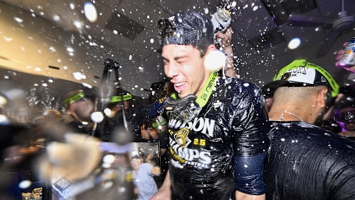 Sep 21, 2025; St. Louis, Missouri, USA; Milwaukee Brewers left fielder Christian Yelich (22) is showered with beer and champagne after the Brewers clinched the 2025 National League Central Division Championship following a game against the St. Louis Cardinals at Busch Stadium. Mandatory Credit: Jeff Curry-Imagn Images