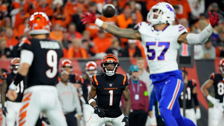 Nov 5, 2023; Cincinnati, Ohio, USA; Cincinnati Bengals wide receiver Ja'Marr Chase (1) receives a throw a from quarterback Joe Burrow (9) as Buffalo Bills defensive end A.J. Epenesa (57) defends in the second quarter at Paycor Stadium. Mandatory Credit: Kareem Elgazzar-USA TODAY Sports Nov 5, 2023; Cincinnati, Ohio, USA; Cincinnati Bengals wide receiver Ja'Marr Chase (1) receives a throw a from quarterback Joe Burrow (9) as Buffalo Bills defensive end A.J. Epenesa (57) defends in the second quarter at Paycor Stadium. Mandatory Credit: Kareem Elgazzar-USA TODAY Sports
