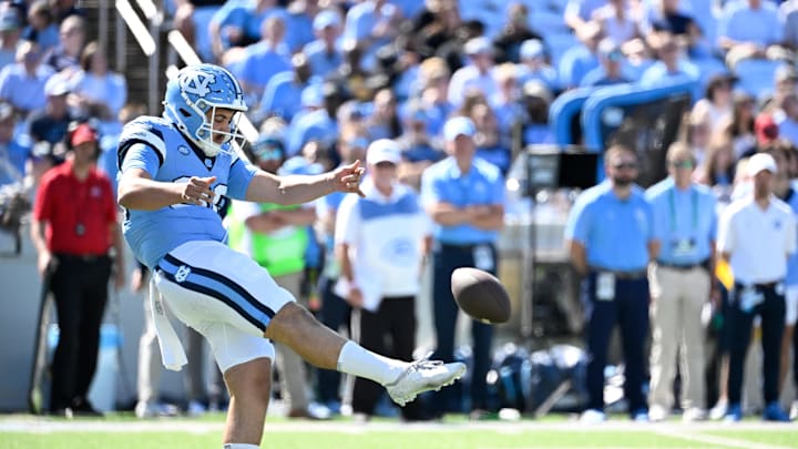 Oct 12, 2024; Chapel Hill, North Carolina, USA; North Carolina Tar Heels punter Tom Maginness (96) punrts in the first quarter at Kenan Memorial Stadium. Mandatory Credit: Bob Donnan-Imagn Images Oct 12, 2024; Chapel Hill, North Carolina, USA; North Carolina Tar Heels punter Tom Maginness (96) punrts in the first quarter at Kenan Memorial Stadium. Mandatory Credit: Bob Donnan-Imagn Images