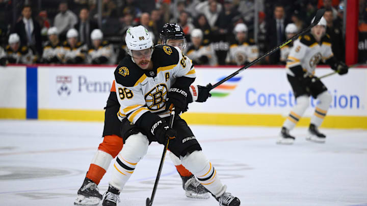 Nov 2, 2024; Philadelphia, Pennsylvania, USA; Boston Bruins right wing David Pastrnak (88) controls the puck against the Philadelphia Flyers in the first period at Wells Fargo Center. Mandatory Credit: Kyle Ross-Imagn Images