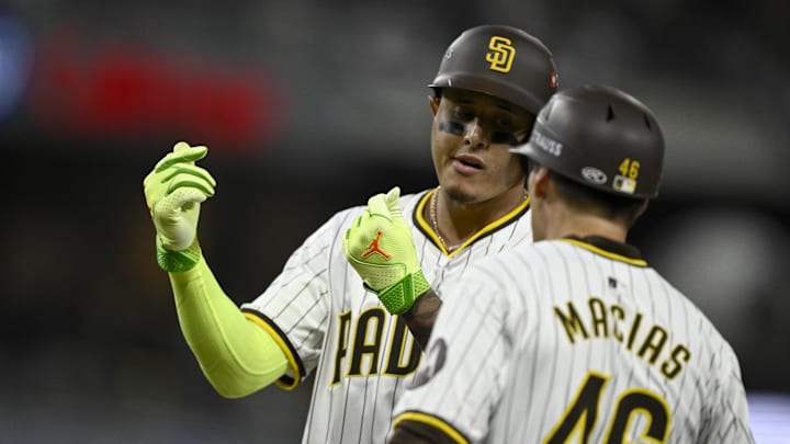 Oct 8, 2024; San Diego, California, USA; San Diego Padres third baseman Manny Machado (13) reacts after a single in the second inning against the Los Angeles Dodgers during game three of the NLDS for the 2024 MLB Playoffs at Petco Park.  Mandatory Credit: Denis Poroy-Imagn Images