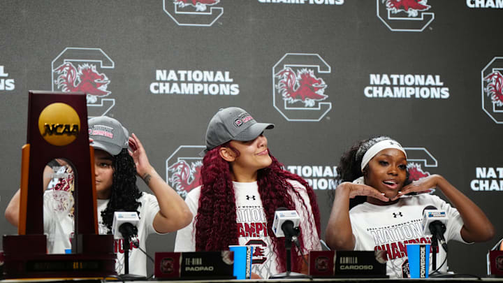 Apr 7, 2024; Cleveland, OH, USA; South Carolina Gamecocks guard Te-Hina Paopao (0) and center Kamilla Cardoso (10) and guard Raven Johnson (25) speak in a press conference after defeating the Iowa Hawkeyes in the finals of the Final Four of the womens 2024 NCAA Tournament at Rocket Mortgage FieldHouse. Mandatory Credit: Kirby Lee-Imagn Images