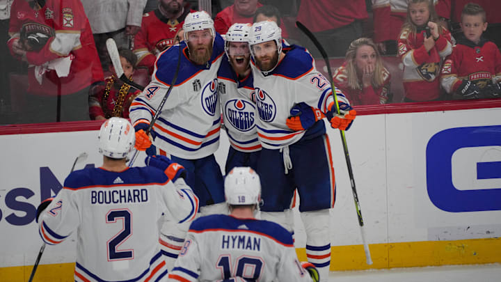 Edmonton Oilers forward Connor McDavid (97) celebrates scoring an empty net goal.